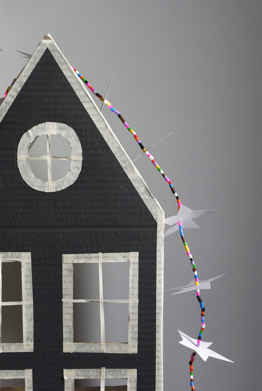 cardboard house with LED star strand